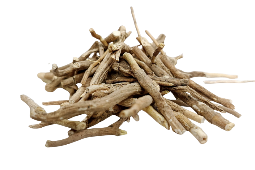 Coarse-cut dried ashwagandha roots (Withania somnifera Coarse cut) pile on white background